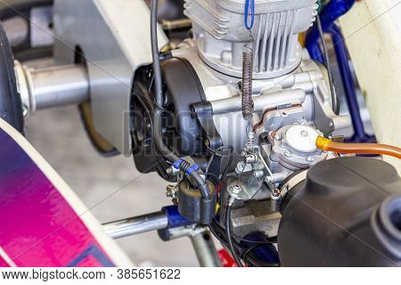 Close Up Carburetor And Cable Choke Assembly With Body And Cylinder Head Of 2 Stroke Engine Of Sport