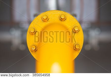 Flange Connection. Yellow Pipe. Flanged Connection On A Large Yellow Pipe.