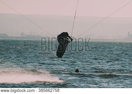 Wakeboarding At The Sea Jumping High Doing A Backflip.