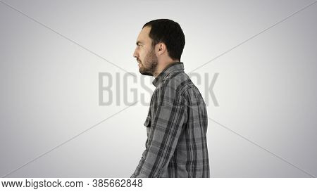 Confident Successful Smart Casual Businessman Walking On Gradien