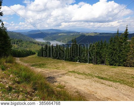 Marisel Ski Slope And Belis Lake In Summer On Sunny Day, Romania. Apuseni Mountains Scene, Cluj Coun