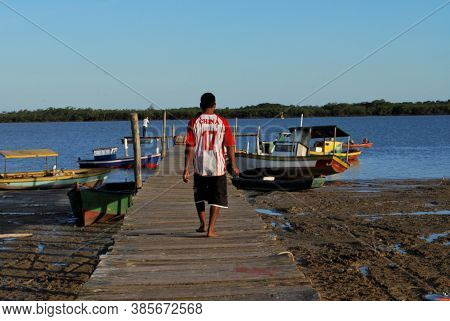Caravelas, Bahia / Brazil - June 16, 2009: Wooden Pier To Access The Port Of Fishing Boats On The Ca