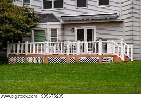 House With A Veranda And A White Fence Porch Building