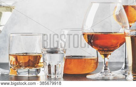 Set Of Hard Strong Alcoholic Drinks And Spirits In Glasses In Assortment: Vodka, Cognac, Tequila, Br