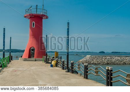 Seosan-si, South Korea; August 28, 2020: For Editorial Use Only. Closeup Of Red Lighthouse On End Of