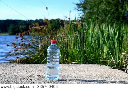 Bottle Of Water In Front Of A Lake