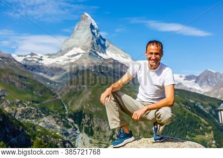 Active Family Hiking In High Alpine Region In Alps