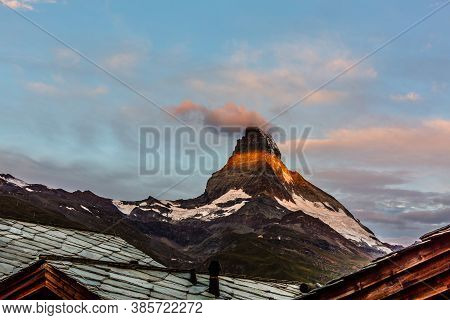Zermatt, Switzerland. Matterhorn Mountain Near Grindjisee Lake With Flowers In The Foreground. Canto