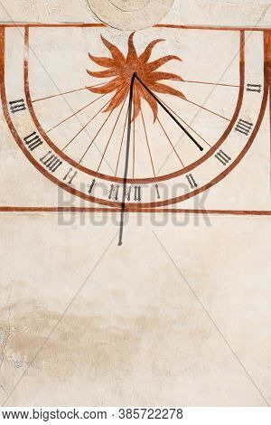 Mustair, Switzerland - September 8, 2020: Medieval Sundial On The Wall In Mustair
