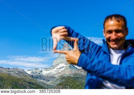 Active Man Hiking In High Alpine Region In Alps