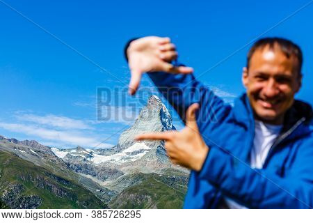 Active Family Hiking In High Alpine Region In Alps