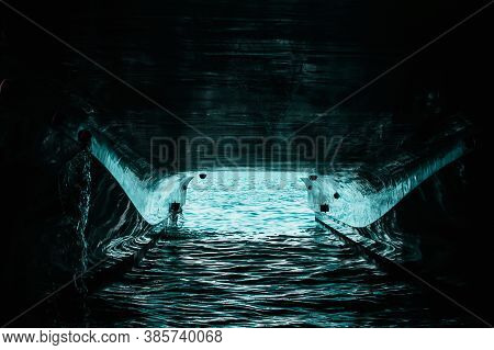 Underside Of A Double Hull Passenger Boat, Water Reflecting Off The Painted Hull. Canal Of Light Thr
