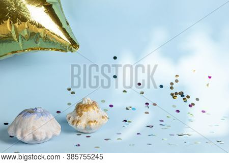 Halloween Decoration With White Pumpkins, Gold Balloon And Colorful Confetti On Blue Background. Tha