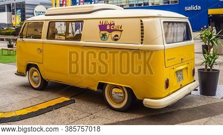 A Coruña, Spain; 08/11/2020: Yellow Classic Volkswagen Transporter Type 2. Vehicle Parked In An Espl