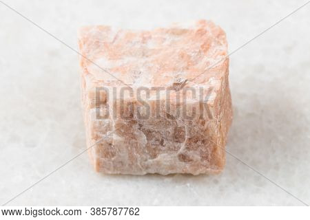 Closeup Of Sample Of Natural Mineral From Geological Collection - Unpolished Feldspar Rock On White 
