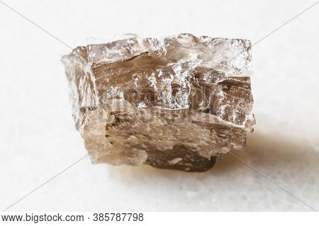 Closeup Of Sample Of Natural Mineral From Geological Collection - Rough Smoky Quartz Rock On White M