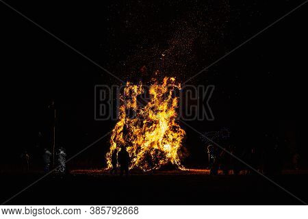 Ancient Tradition Of Epiphany Fires In Friuli, Italy. Burning Of A Straw Effigy. Farewell To Winter,