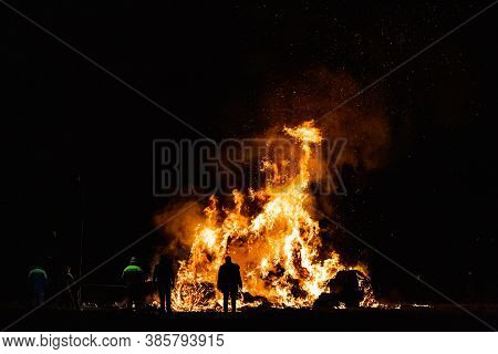 Ancient Tradition Of Epiphany Fires In Friuli, Italy. Burning Of A Straw Effigy. Farewell To Winter,
