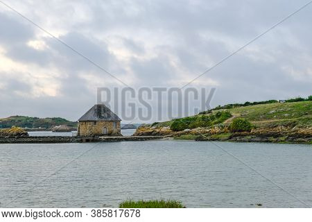 Ile De Brehat, France - August 27, 2019: Moulin A Maree Du Birlot Or Birlot Tide Mill Located On The