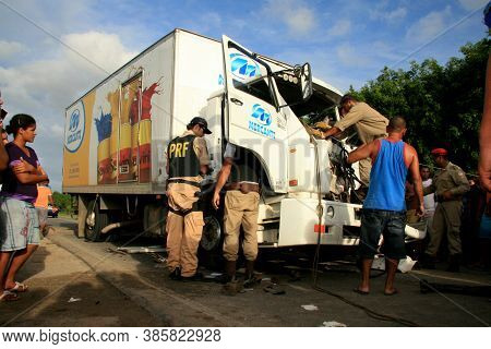 Eunapolis, Bahia / Brazil - January 28, 2009: People Come To The Rescue Of A Truck Driver Trapped In
