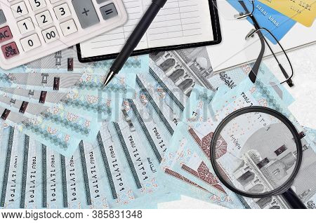 5 Egyptian Pounds Bills And Calculator With Glasses And Pen. Tax Payment Season Concept Or Investmen