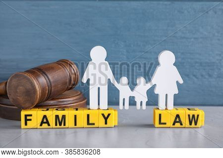 Cubes With Letters, Judge Gavel And Family Figure On Light Table. Family Law Concept