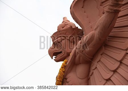 Garuda Statue On The Top Of Building On White Sky Background. A Symbol Of Thailand And Believe Are T