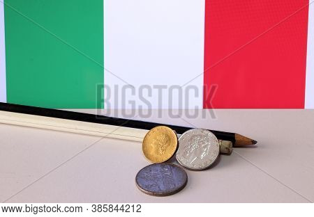 Heap Of Italy Coins And Pencil On White Floor With Italia Flag Background, Repvbblica Italiana, Lire