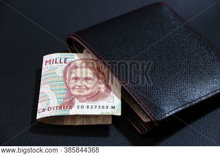 One Thousand Lire Of Italy Banknote With Black Wallet On The Black Floor, Lire Italia Money The Conc