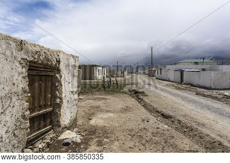Small Town Of Alichur In Region Murghob In Gorno-badakshan  With Houses And Unpaved Roads.
