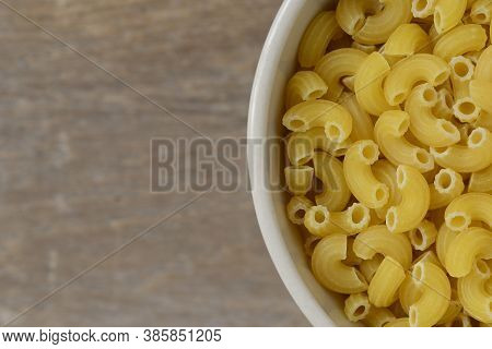 Macro Photo Food Product Raw Eibow Macaroni Vermicelli , Close Up Of Italian Macaroni Pasta Food
