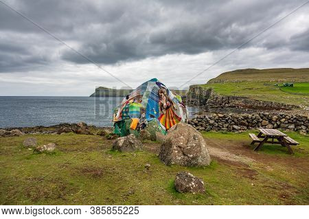 Eldgos And Frumskogur, Boulder Covered With Clothes In Sandoy