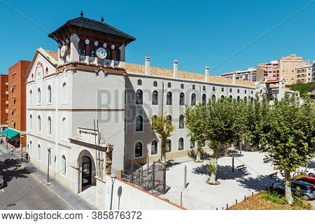 TARRAGONA, SPAIN - SEPTEMBER 3, 2020: A view over the Chartreuse building in Tarragona, Spain. It was formerly a factory of the Chartreuse liqueur and now is a public governmental school of languages