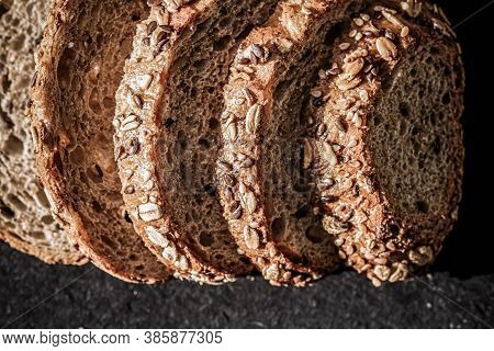 Fresh Whole Grain Seeded Bread, Organic Wheat Flour, Closeup Slice Texture As Background For Food Bl