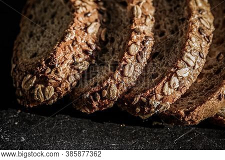 Fresh Whole Grain Seeded Bread, Organic Wheat Flour, Closeup Slice Texture As Background For Food Bl