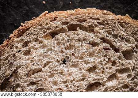 Fresh Whole Grain Seeded Bread, Organic Wheat Flour, Closeup Slice Texture As Background For Food Bl