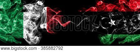 Italy Vs Libya, Libyan Smoky Mystic Flags Placed Side By Side. Thick Colored Silky Abstract Smoke Fl