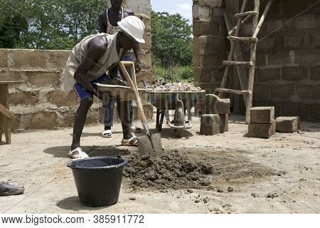 Kabala, Sierra Leone - May 29th 2019: Young African Working In Construction In Africa. Construction 