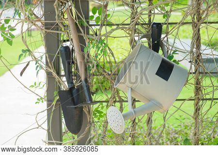 A Shower Can Water Plants, Pickaxes And Spakes Hang On The Steel Panel