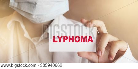 Doctor Keeps A Card With The Name Of The Diagnosis Lymphoma. Selective Focus. Medical Concept