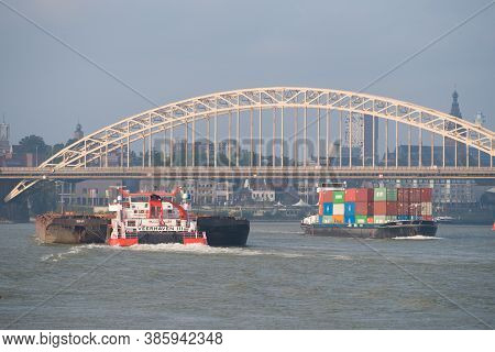Nijmegen, Netherlands - September 12, 2020: Industrial Ship On The Waal River At Nijmegen In The Net