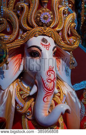 Face Of Lord Ganesha, Durga Puja Festival At Night. Shot Under Colored Light At Howrah, West Bengal,