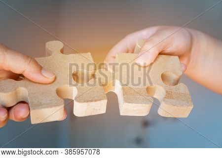 Businesswoman Hand Of Teamwork Holding Jigsaw Puzzle Connecting, Business Team Work Of Solutions In 
