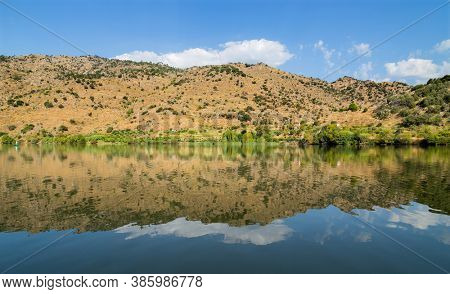 River Douro flowing through narrow rocky gorge in Portugal. Douro Region.