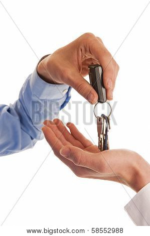 Two Hands Handing Over Keys