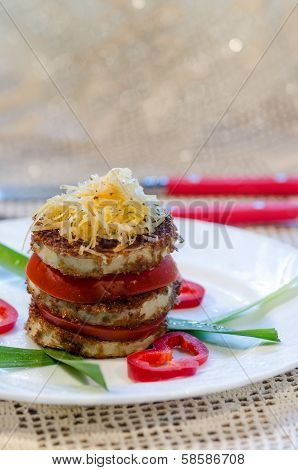Fried Zucchini With Fresh Tomato And Grated Cheese