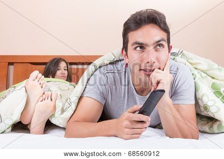 married couple lying in bed
