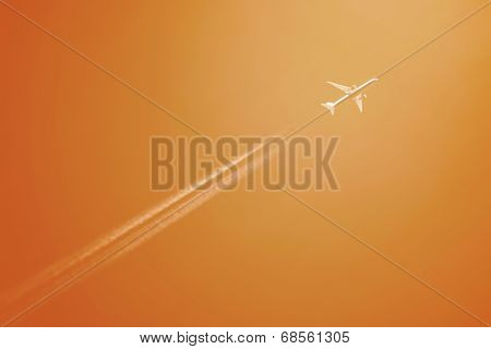 Airliner At High Altitude With White Condesation Trails