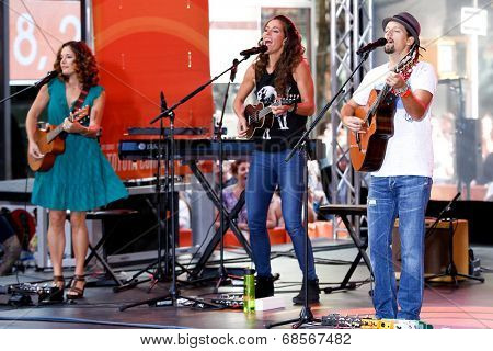 NEW YORK-JUL 18: Singer Jason Mraz (R) performs in concert with Mai Bloomfield (L) and Chaska Potter (C) of Raining Jane at NBC's 'Today Show' at Rockefeller Plaza on July 18, 2014 in New York City.
