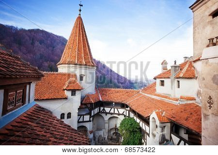 Red roofs of Bran Castle in inner yard, Romania